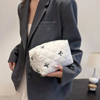 White quilted cosmetic bag with bow embroidery and zip closure