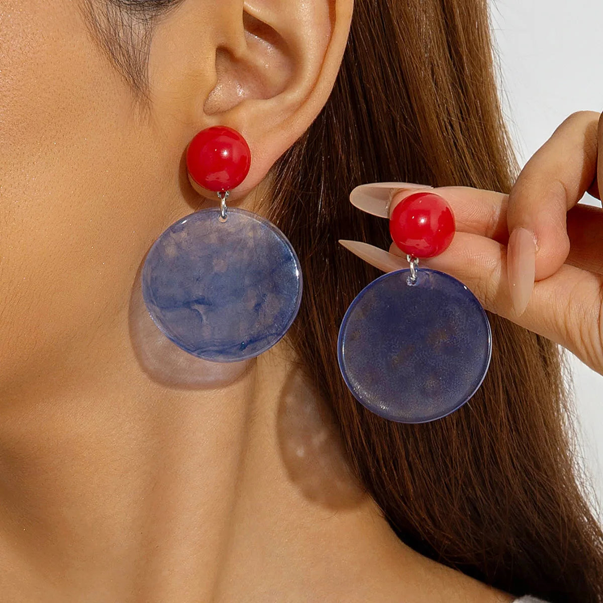 Red ball stud drop earrings with translucent blue round discs and silver-tone hanging hooks