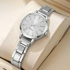 Silver-tone quartz watch with white dial and metal link bracelet on a display cushion