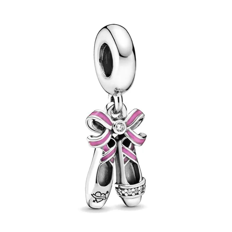 Sterling silver charm bead with pink ribbon bow and small dangling details