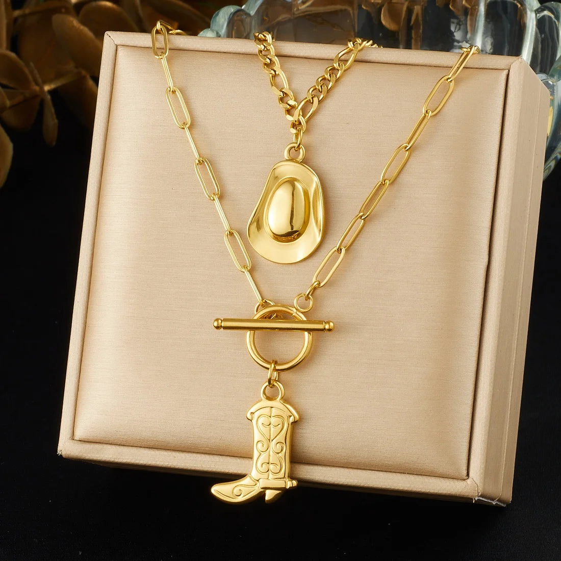 Gold-tone cowboy hat and boot pendant necklace with decorative buckle charm