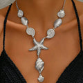 Silver shell and starfish pendant necklace with spiral discs, scallop shells, and hanging charm