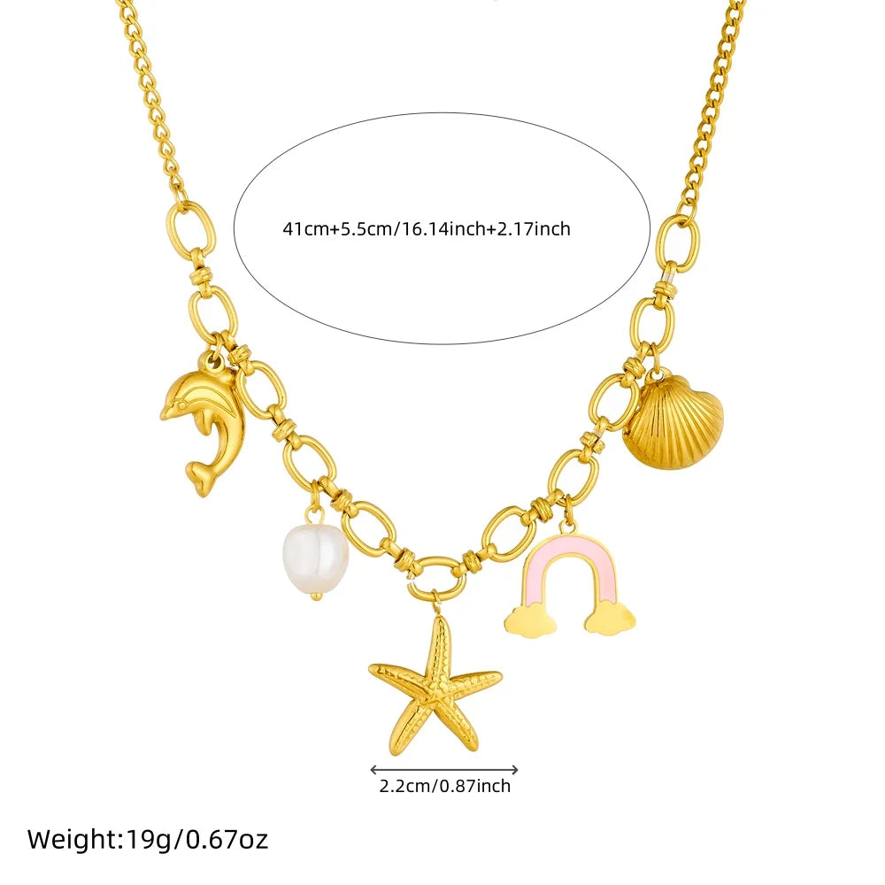 Gold-tone multi-pendant necklace with dolphin, pearl, rainbow cloud, starfish and shell charms