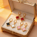 Four-leaf clover dangle earrings in gift box, showing red, black, white, and pink clovers