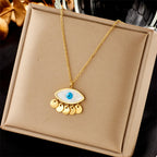 Eye pendant choker necklace, gold chain with blue evil-eye charm and hanging gold drops