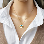 Eye pendant choker necklace, gold chain with blue evil-eye charm and scalloped drops