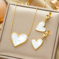 Gold-plated necklace and earrings set with white heart shell drop charms