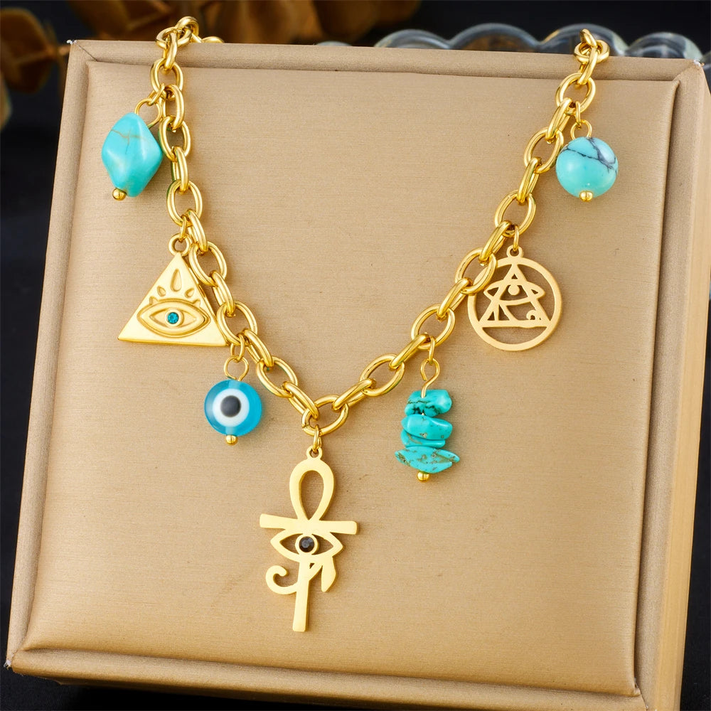 Gold-tone multi-pendant necklace with turquoise beads and heart, evil-eye charms