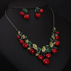 Cherry fruit necklace and earrings set, draped chain with red cherry clusters and green leaves