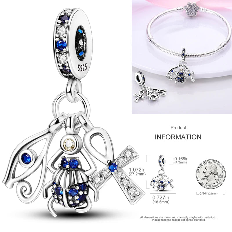 925 sterling silver religious figure charm with blue stone accents and crystal details