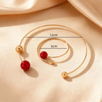 Gold-tone collar and bracelet set with red pearls, 12cm necklace and 6cm bracelet