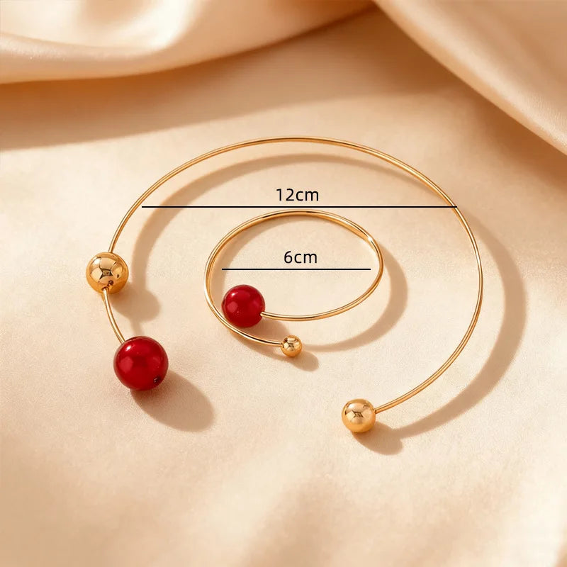 Gold-tone collar and bracelet set with red pearls, 12cm necklace and 6cm bracelet
