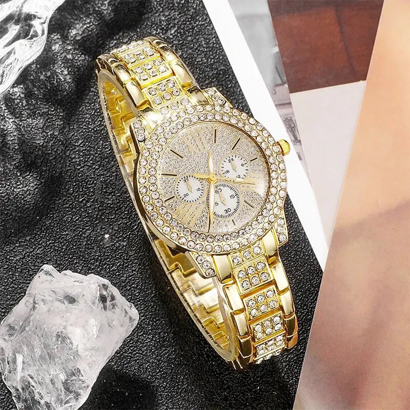 Gold rhinestone wrist watch with three small chronograph dials and jeweled bracelet