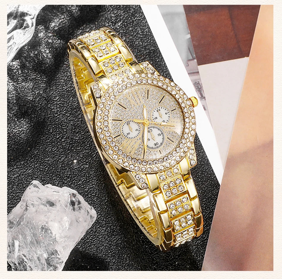 Gold-tone rhinestone watch with three subdials and crystal-studded bracelet strap
