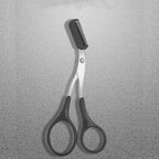 Eyebrow scissors with comb, close-up of black comb head and silver blades