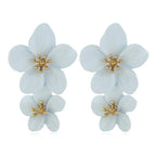 Light blue double-layer flower dangle earrings with gold-tone star centers