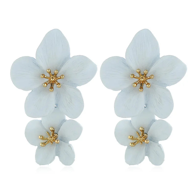 Light blue double-layer flower dangle earrings with gold-tone star centers