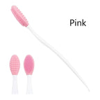 Silicone face cleansing brush with pink oval head and white handle