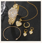 Gold watch with rhinestone bracelet; heart pendant, hoop earrings, bangles, and rings