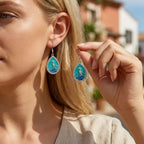 Teardrop seahorse drop earrings with teal enamel and silver-tone border