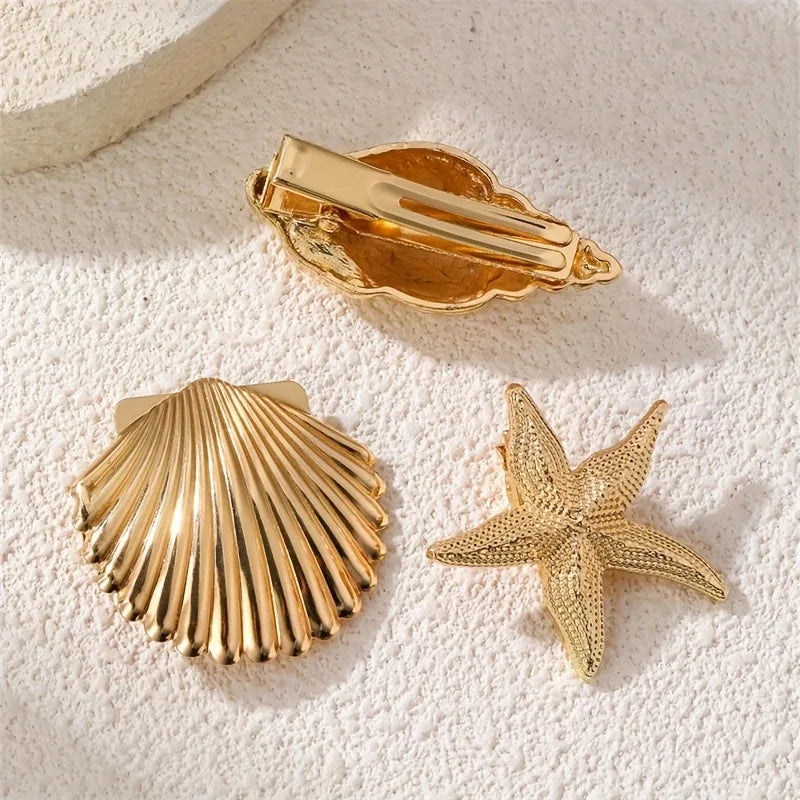 Gold shell hair barrette clip with scallop-shell and starfish embellishments