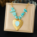Heart pendant necklace with gold-tone chain, turquoise beads, and blue heart centerpiece.