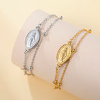 Stainless steel bracelet with oval Virgin Mary pendant, cross charm, and link chain