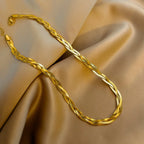 Gold snake-chain necklace and bracelet set, twisted oval links with clasp hardware