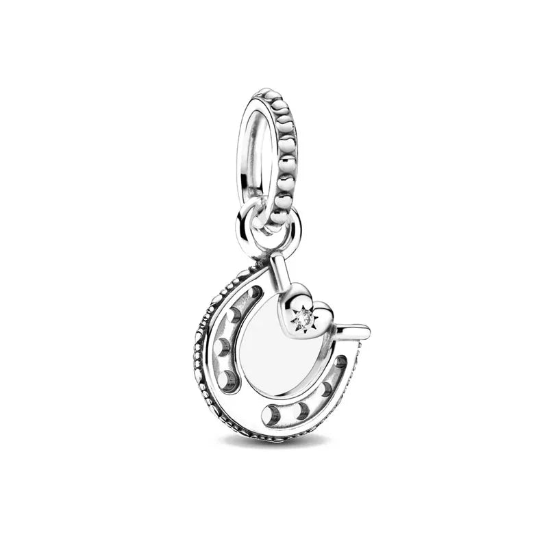 Silver horseshoe charm bead with tiny star accents and round clasp loop