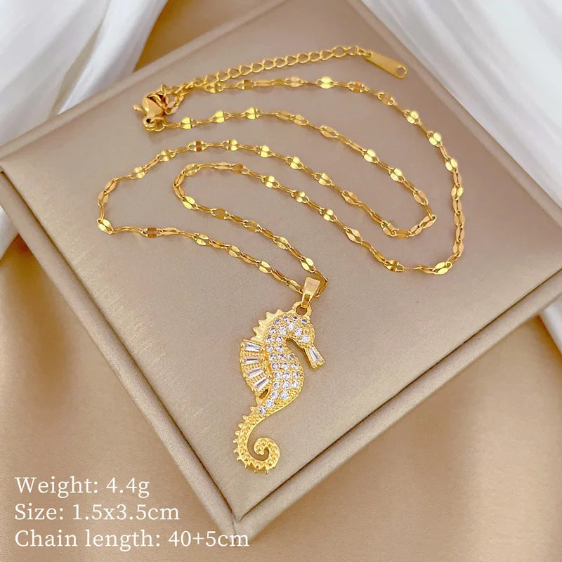Gold-tone seahorse pendant necklace with rhinestone seahorse charm and chain