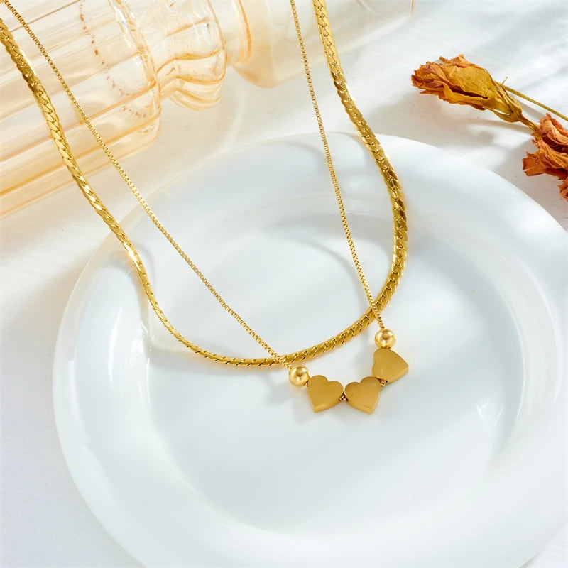Gold double-layer heart necklace with blue and pink enamel heart pendants