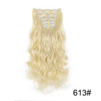 Pale blonde curly clip-in hair extension with metal comb clips at the top