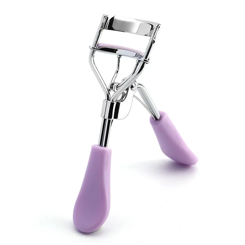 Silver eyelash curler tool with purple grip handle and chrome clamp