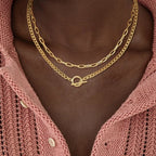 Gold layered chain necklace with oval connector; Cuban link and paperclip styles