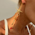 Boucles d'oreilles pendantes bohème à pompons — Étoile de mer et coquillage
