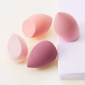 4-piece makeup sponge set with pink and magenta teardrop sponges