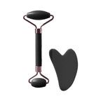 Facial massage roller set with black heart-shaped scraper and rounded base roller