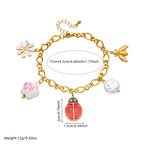 Gold-tone ladybug charm bracelet with flower, bird, and pearl drops; size-mark diagram