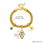 Gold-tone beaded chain bracelet with blue eye charms and dangling hamsa hand pendant