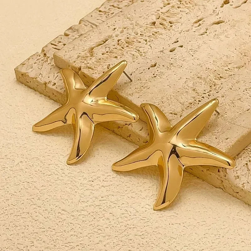 Boucles d'oreilles pendantes bohème à pompons — Étoile de mer et coquillage