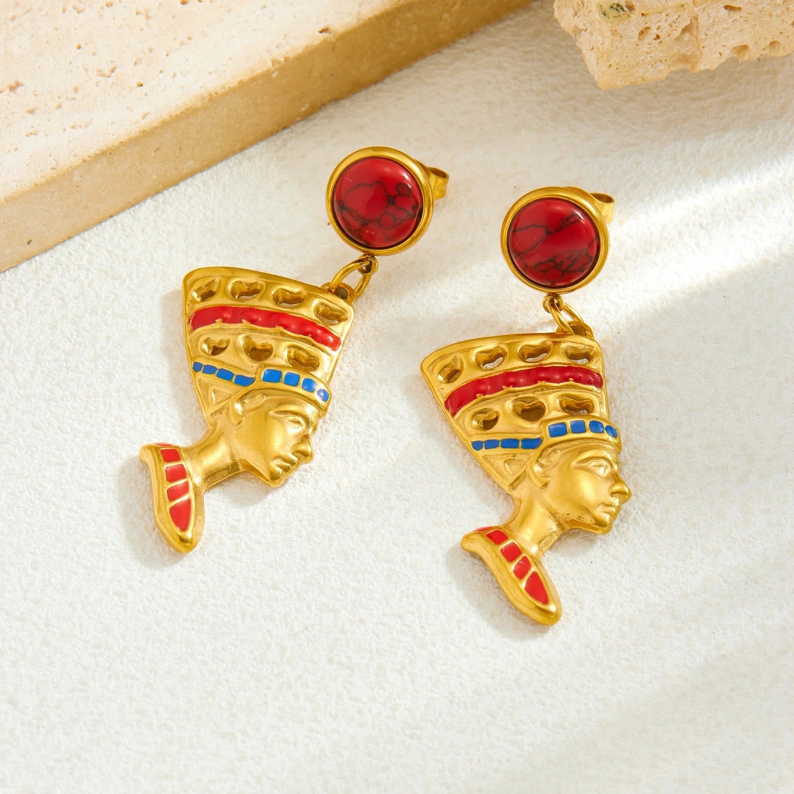 Gold-tone queen head drop earrings with red circular top and blue enamel crown trim