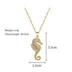 Gold-tone seahorse pendant necklace with rhinestone charm and link chain