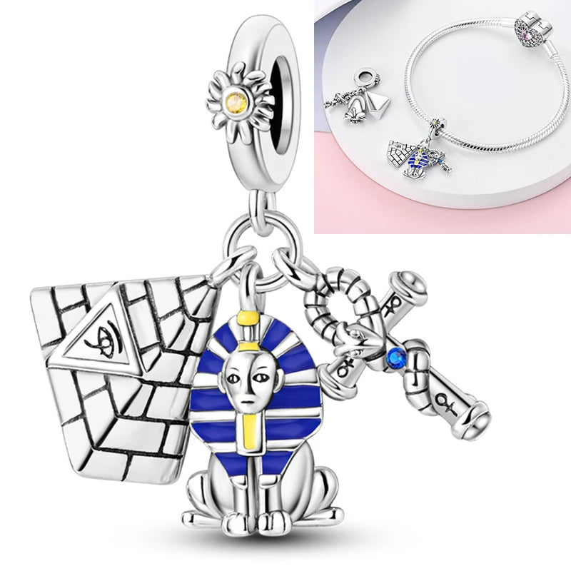 925 sterling silver charm bead featuring a seated figure with blue enamel and a yellow center