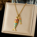 Ocean fish pendant necklace with two multicolor enamel fish charms and gold chain