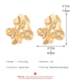 Gold-tone floral textured drop earrings with layered petal shapes