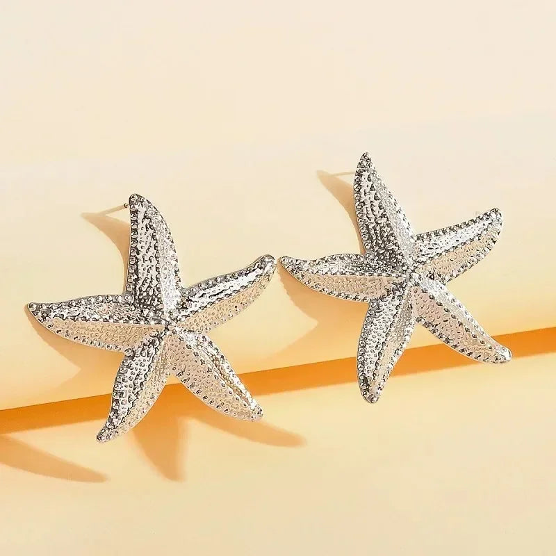 Boucles d'oreilles pendantes bohème à pompons — Étoile de mer et coquillage