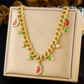 Watermelon enamel charm necklace on display, gold-tone curb chain with watermelon and crystal drops