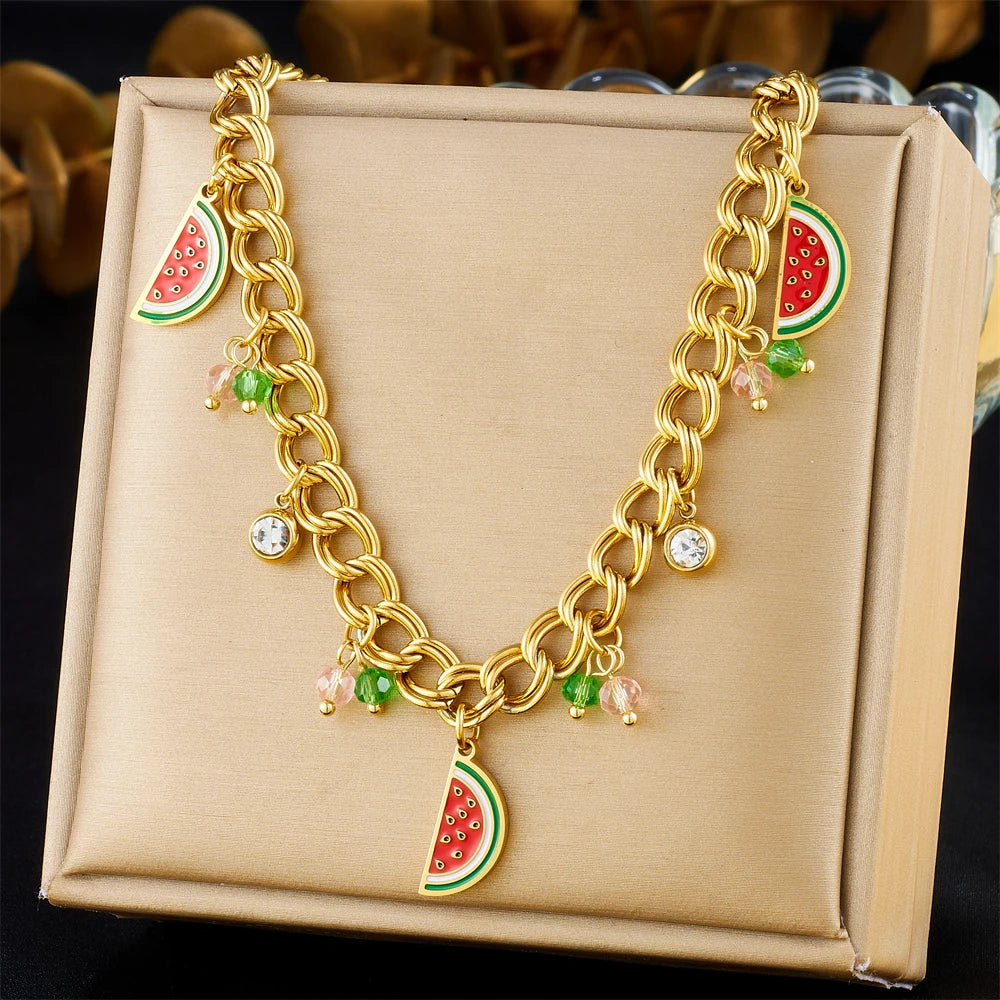 Watermelon enamel charm necklace on display, gold-tone curb chain with watermelon and crystal drops