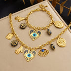Gold evil-eye hamsa charm jewelry set with eye, hand, and heart pendants on chain