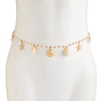 Pearl belly chain on mannequin with starfish and shell charms, gold-tone drops
